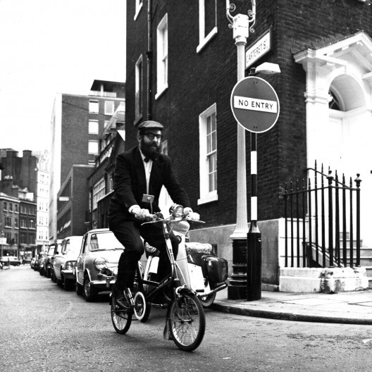 Reyner Banham cycling along Carteret Street, Westminster, London