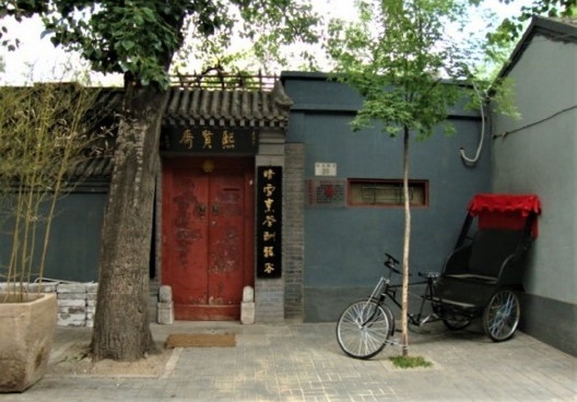 Ciclo-riquixá em Hutong em Beijing