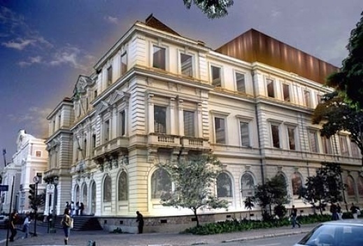 Vista geral do edifício com volume de aço cortém ao fundo