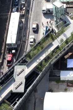 30th Street Cut-Out and Viewing Platform, , a platform above 30th Street where the concrete decking has been removed to expose the steel grid work and street below, looking East. ©Friends of the High Line, 2011