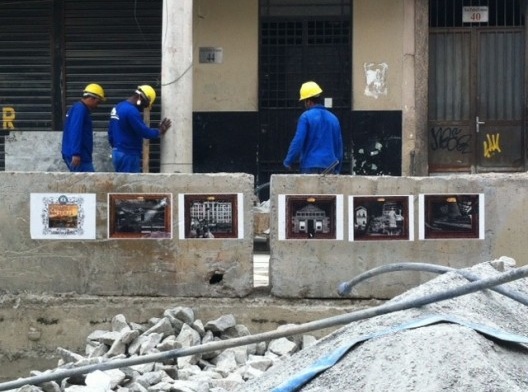 Os pôsteres entre as obras do VLT na frente do Bar do Seu Candinho, outubro 2016