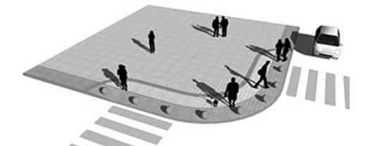 As esquinas são rebaixadas, configurando amplas rampas delimitadas pela faixa de piso tátil e pelos balizadores esféricos. Tornam-se imperceptíveis ao usuário por sua suavidade e pela continuidade do desenho do piso e da faixa de mobilliário